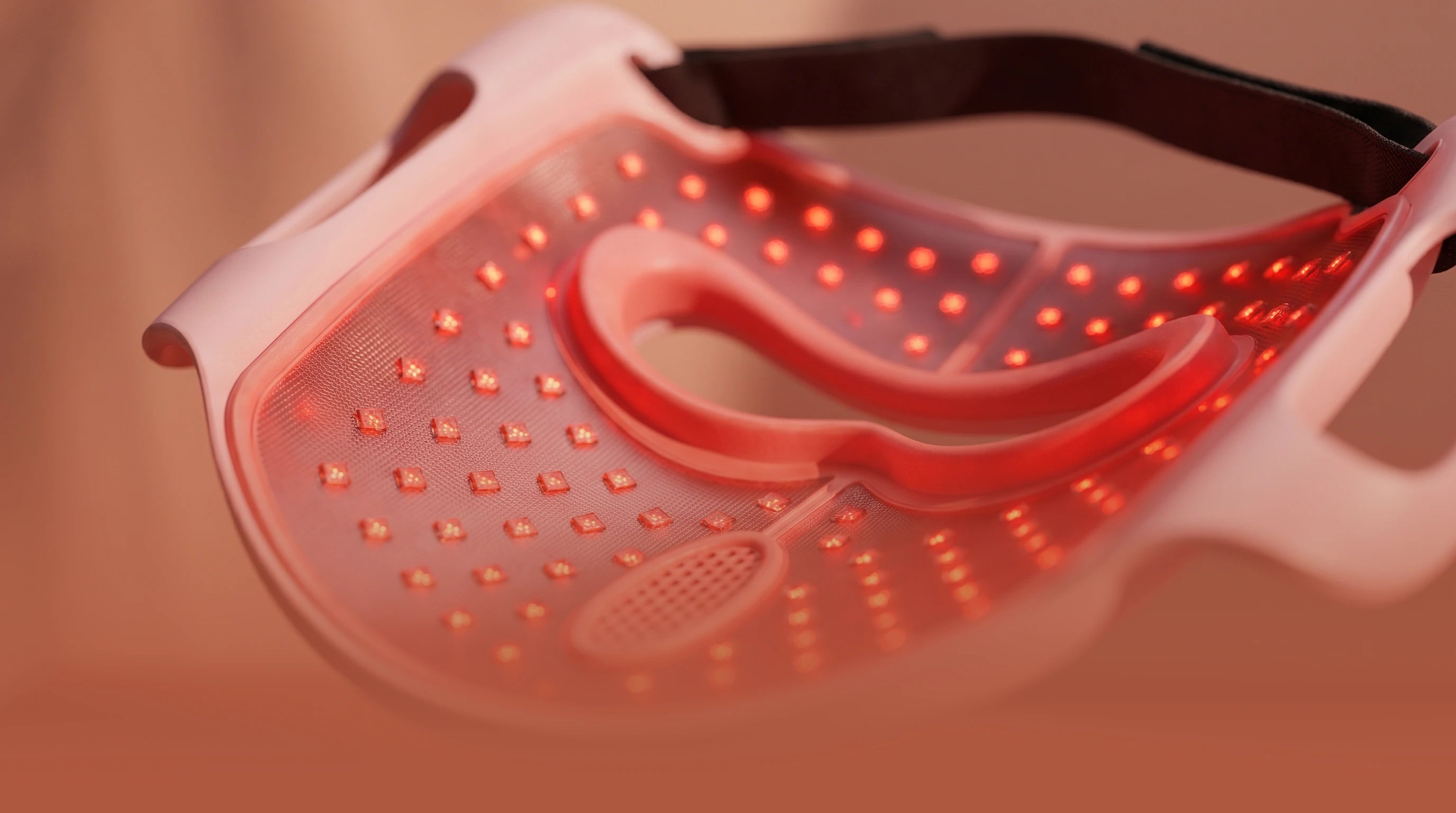 Back view of the Longera AVA LED face and neck mask with the controller display and red light illuminated